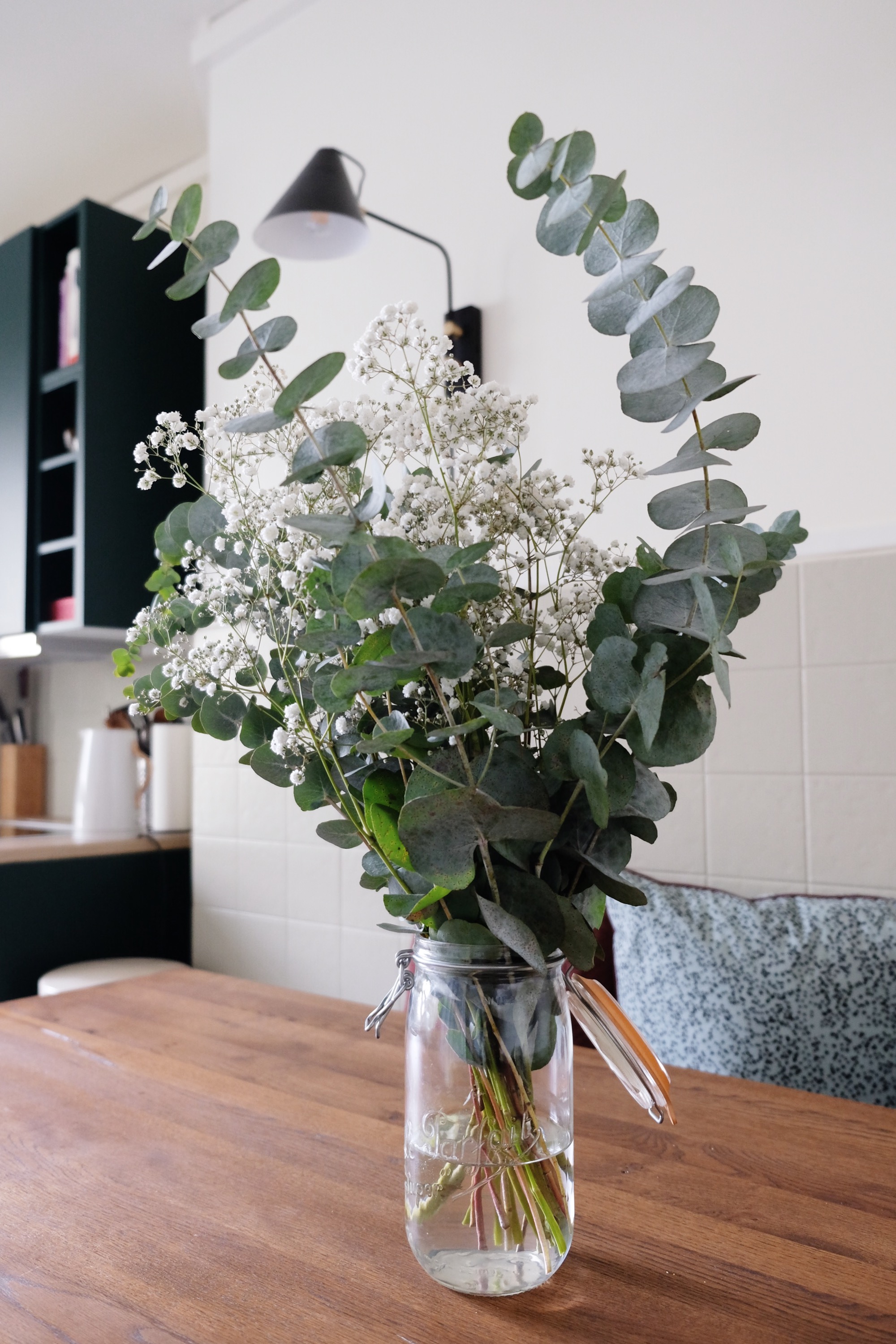 flowers in a jar in the kitchen