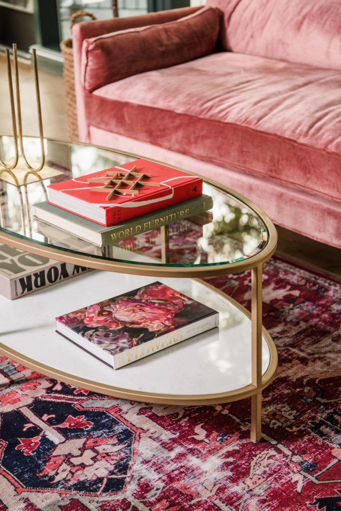 velvet couch and brass coffee table