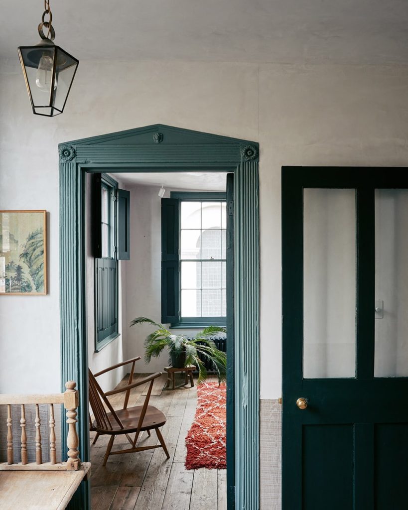 The hallway with green paint door framing