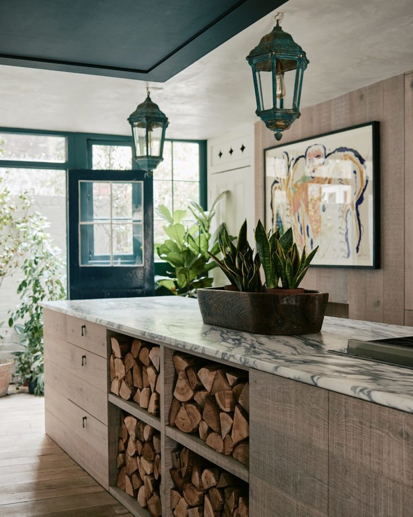 The kitchen with the stone counter and bespoke oak cabinetry