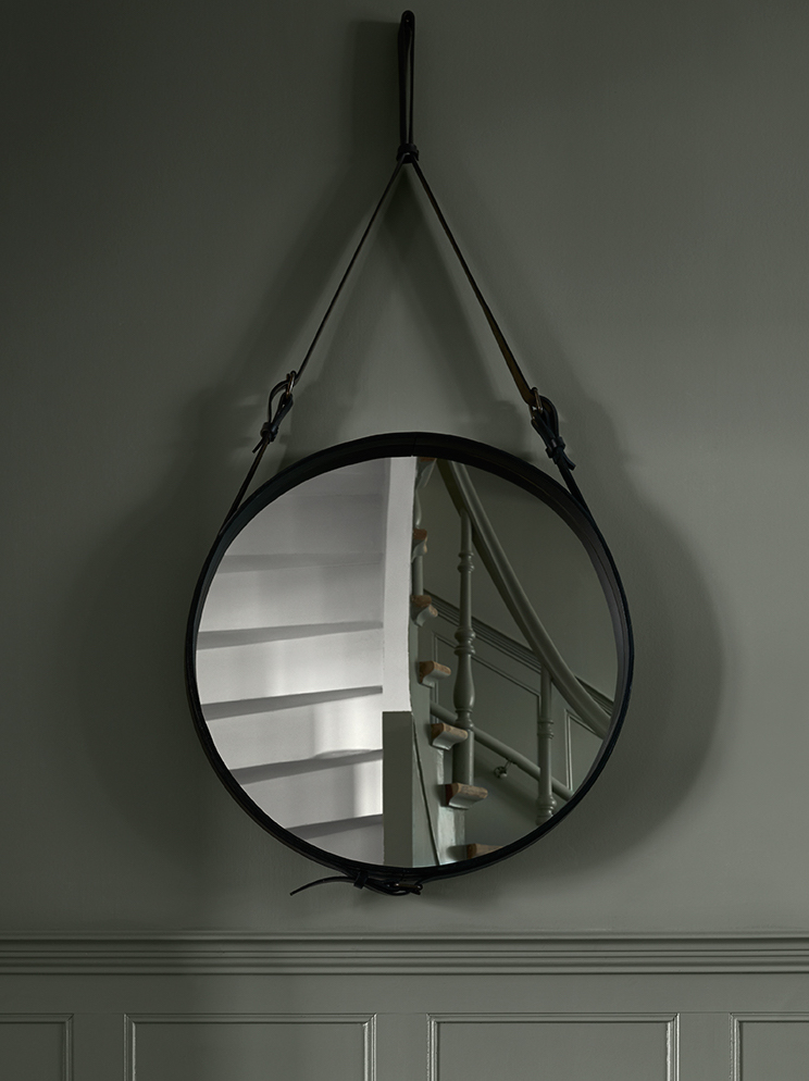 rounded mirror in a hallway