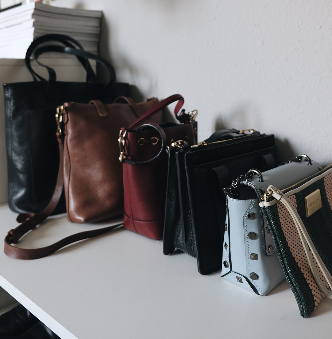 small space closet organization: bags on shelf