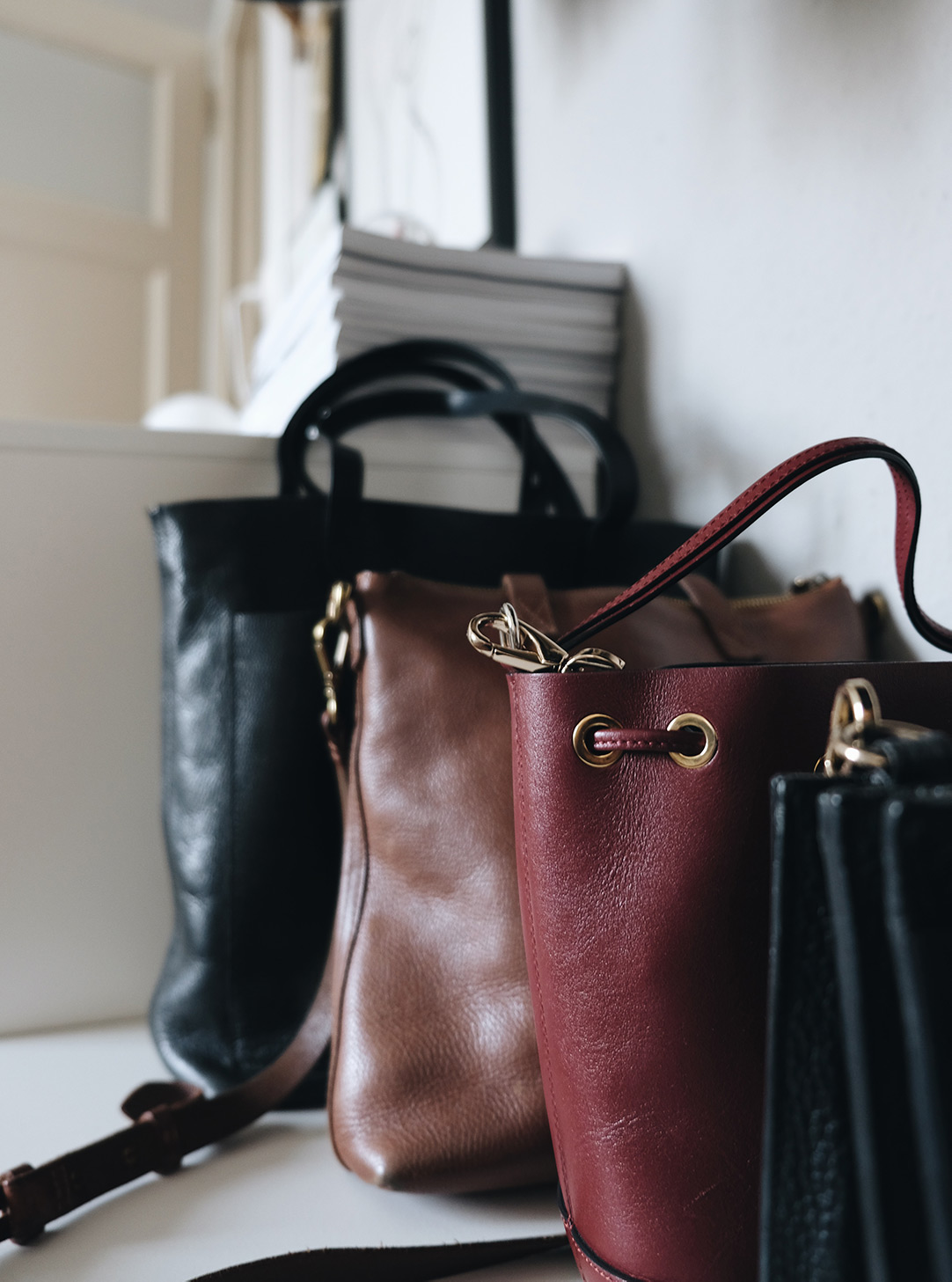 small space closet organization: leather bags