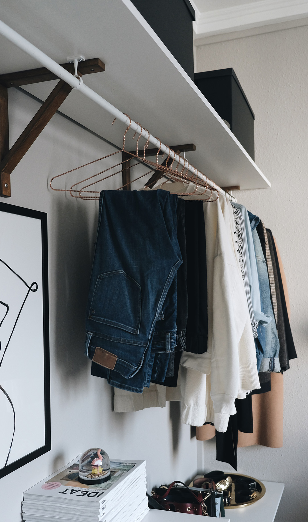 https://thegempicker.com/wp-content/uploads/2020/09/Organizing-a-closet-in-a-small-space-side-view-jeans.jpg