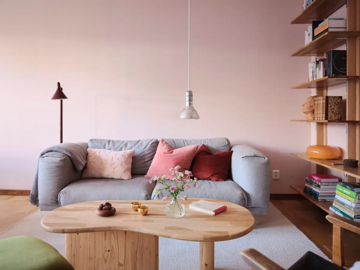 IKEA PS 2026 burgundy floor lamp in a colorful Stockholm living room