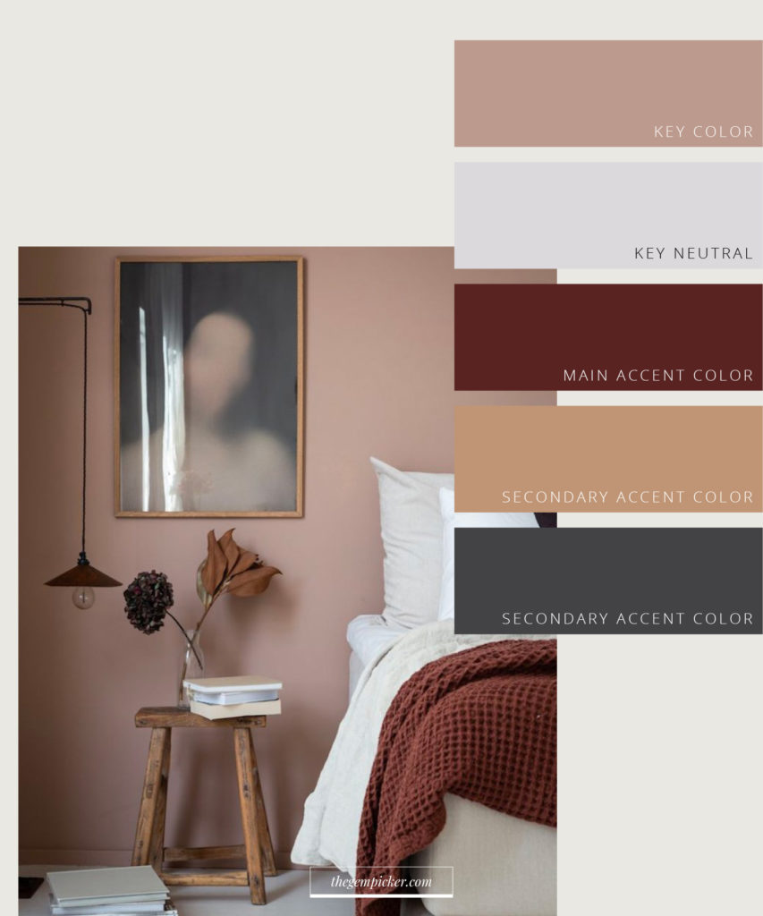 Interior color scheme — warm bedroom with dusty pink walls, pale grey neutral, burgundy throw and camel accents