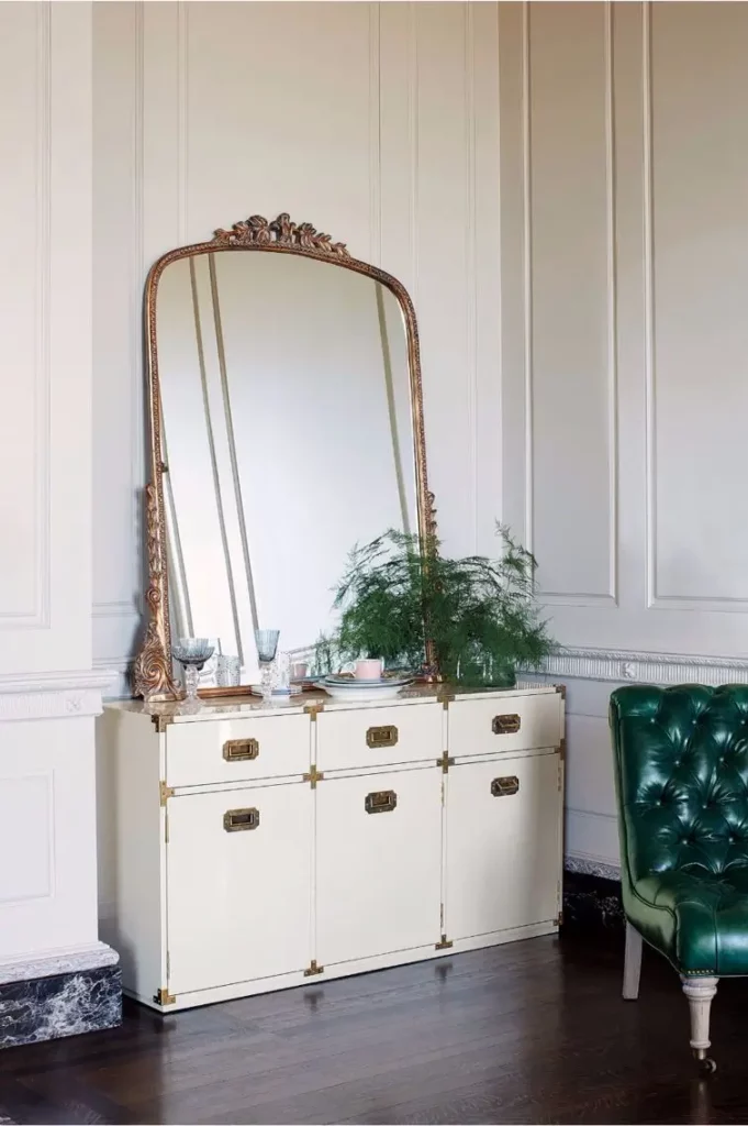 antique mirror above dresser in bed room