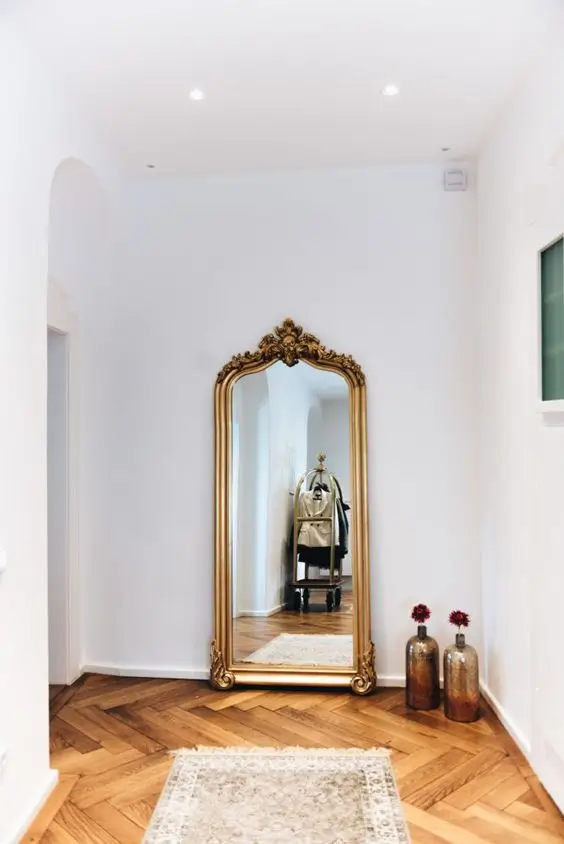 antique gold mirror in entryway