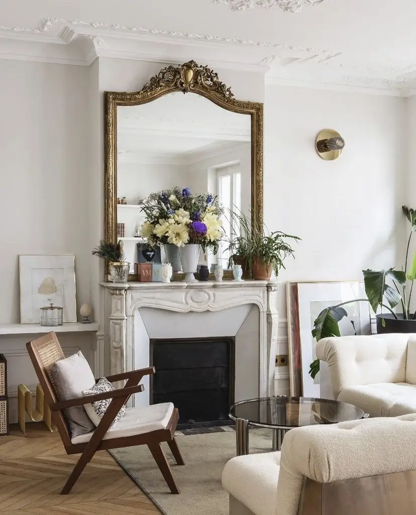 antique gold mirror in living room above fireplace