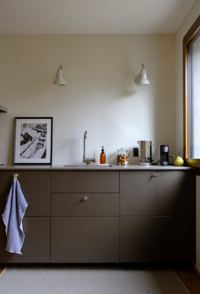 IKEA kitchen sink positioned near window with dishwasher and coffee machine in sequence