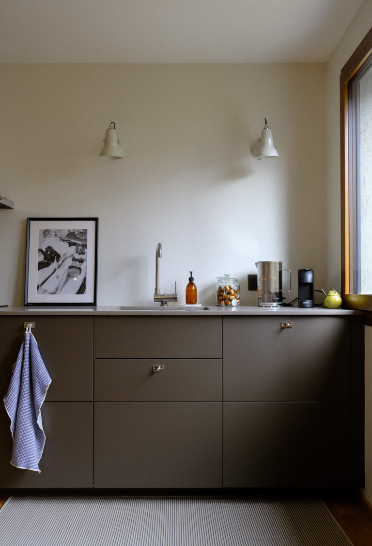 IKEA kitchen sink positioned near window with dishwasher and coffee machine in sequence