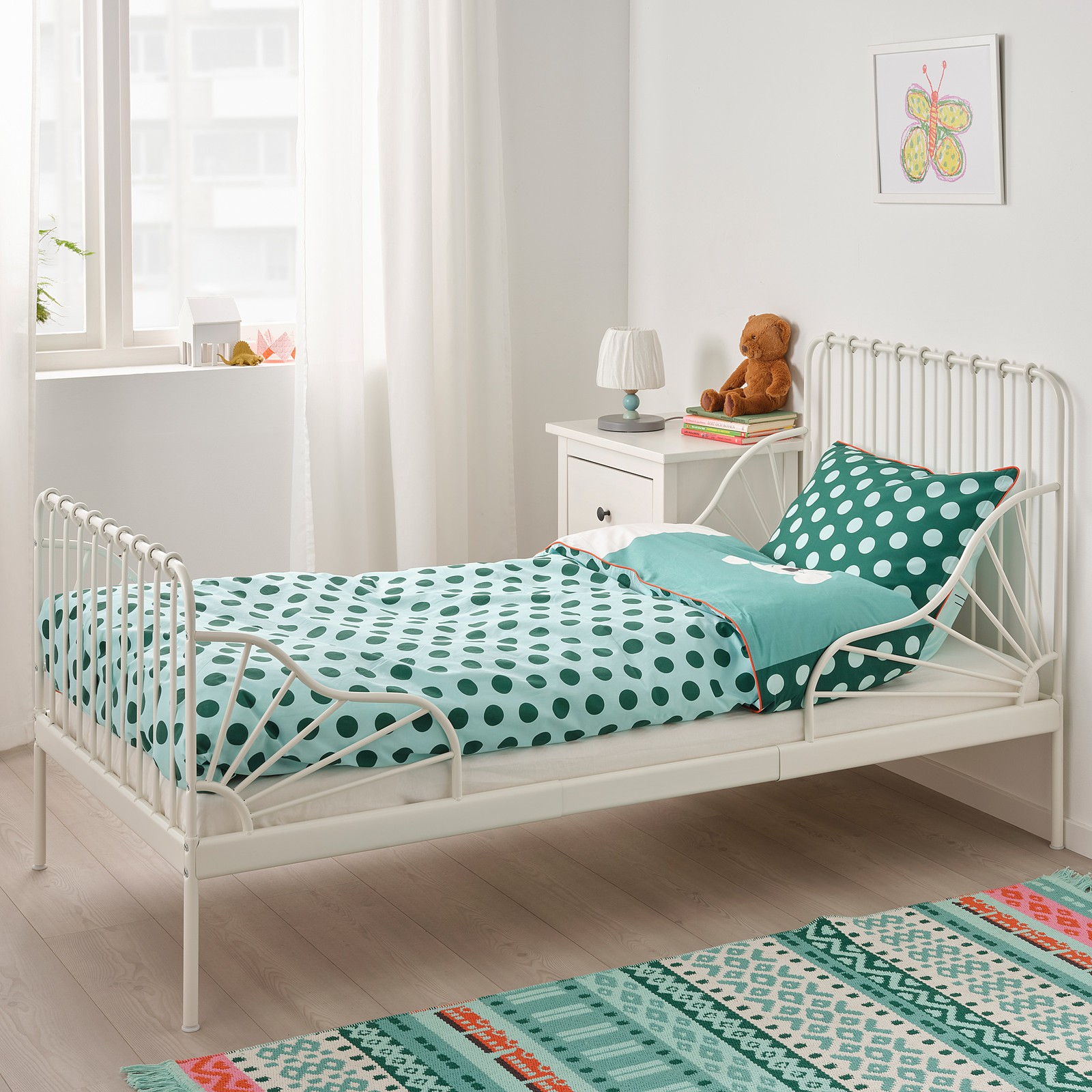 IKEA MINNEN white extendable bed in a bright children's bedroom