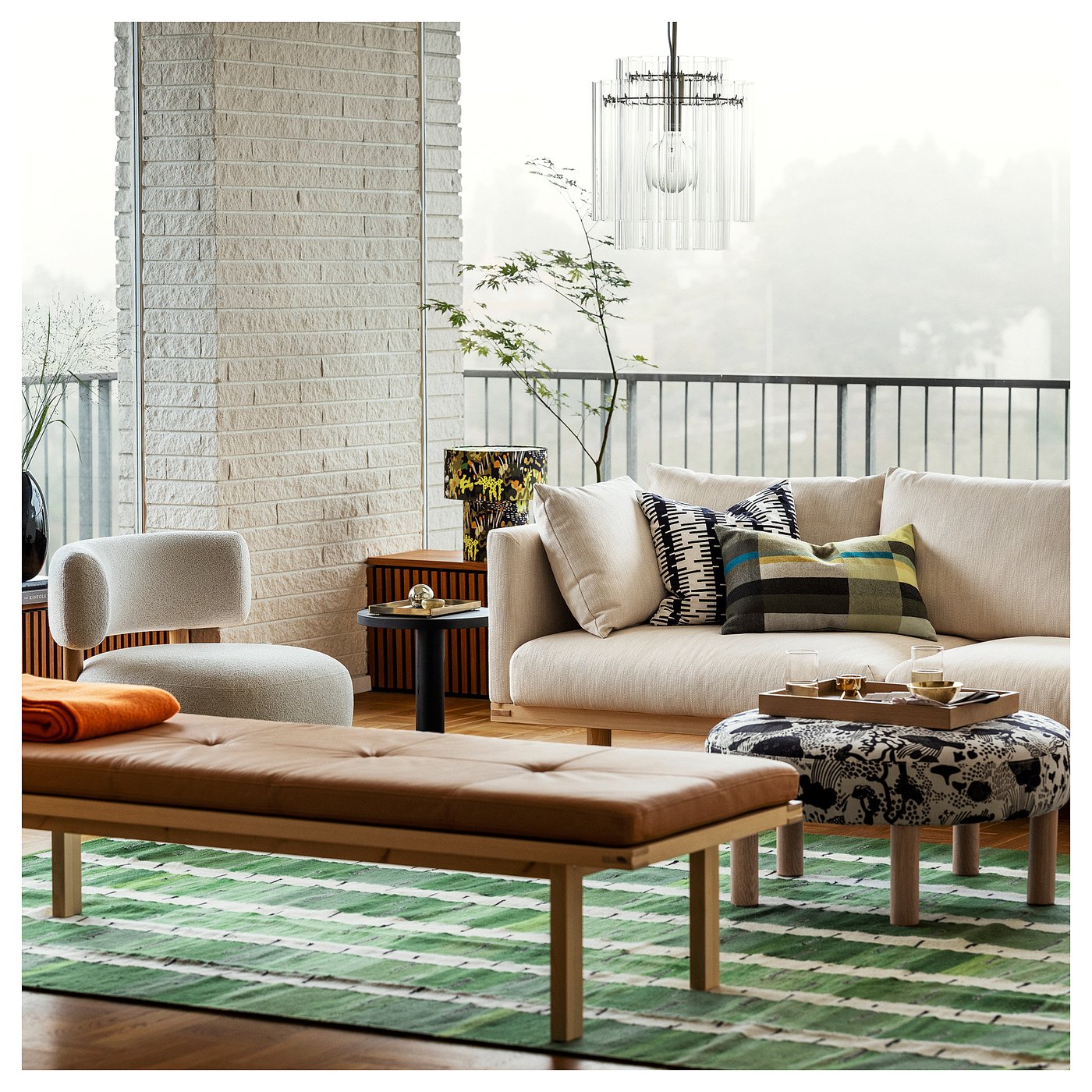 IKEA STOCKHOLM 2025 green white and black handwoven rug in a living room