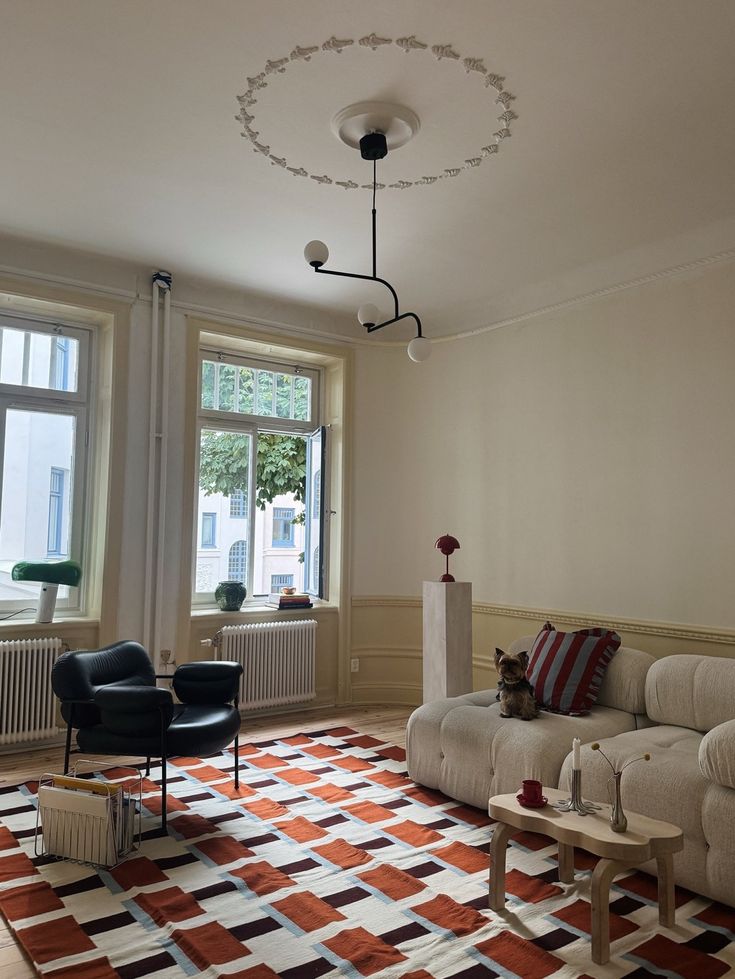 IKEA STOCKHOLM 2025 flatwoven rug in orange, white and brown in a living room